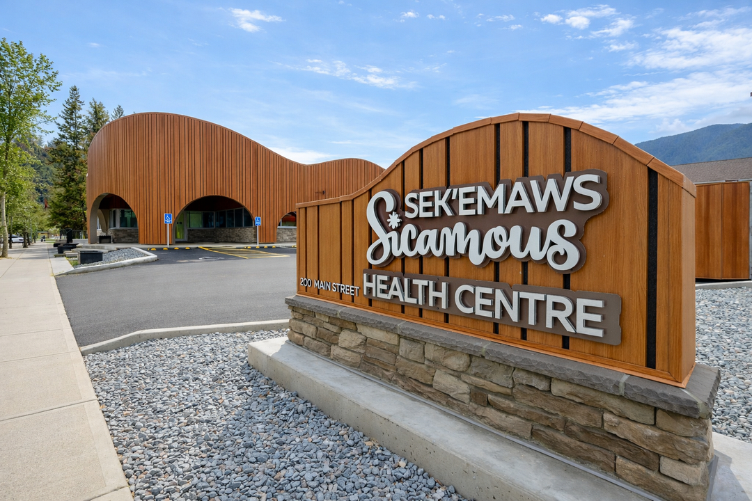 A wood sign Sek`emaws Sicamous Health Center writing